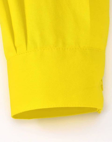 A close-up of a yellow long-sleeved shirt sleeve cuff, featuring a smooth fabric and a logo.