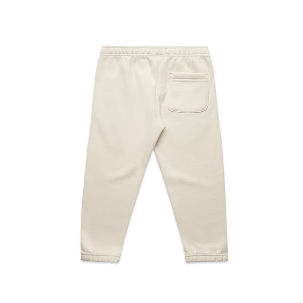 Cream-coloured kids' track pants featuring an elastic waistband and a single back pocket. Includes a logo. Cream-coloured kids' track pants featuring an elastic waistband and a single back pocket. Includes a logo.