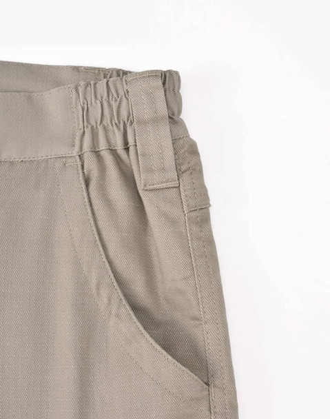 Unisex cotton stretch ripstop work pants in light khaki with an elastic waistband and side pocket detail.