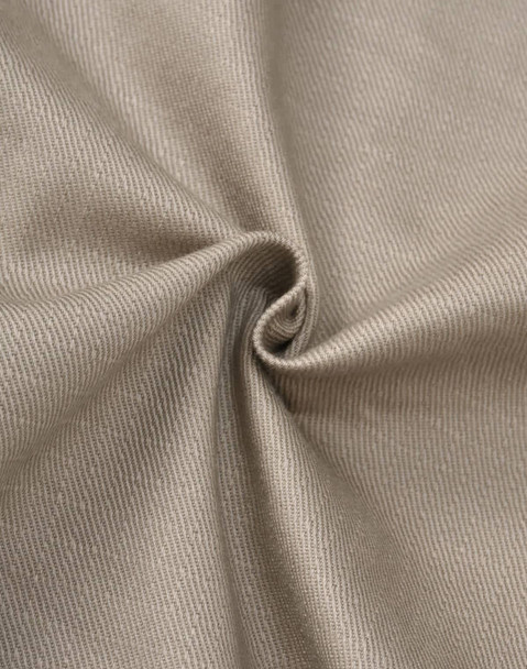 A close-up of beige cotton stretch ripstop fabric, displaying a textured weave and a smooth finish.