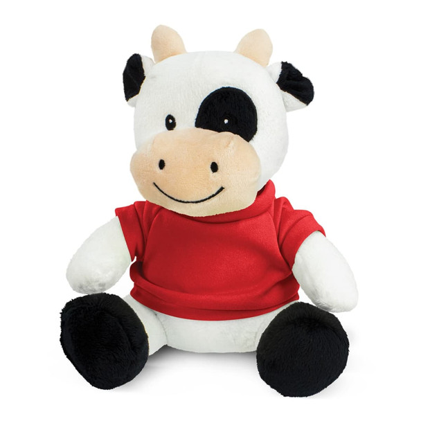 A plush cow toy with a white body, black accents, and a red jersey. It features a friendly smile and big eyes.