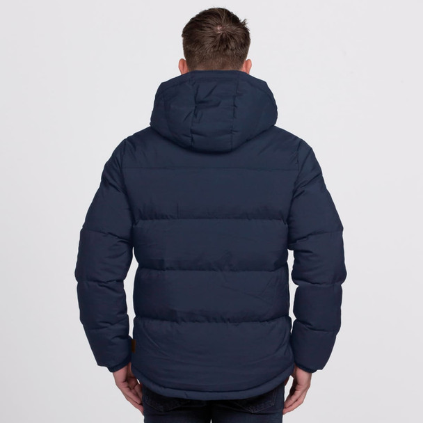 A navy puffer jacket with a hood, featuring a quilted design and a logo on the back. A navy puffer jacket with a hood, featuring a quilted design and a logo on the back.
