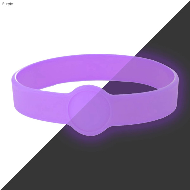 A purple silicone wristband featuring a circular design element and branding.