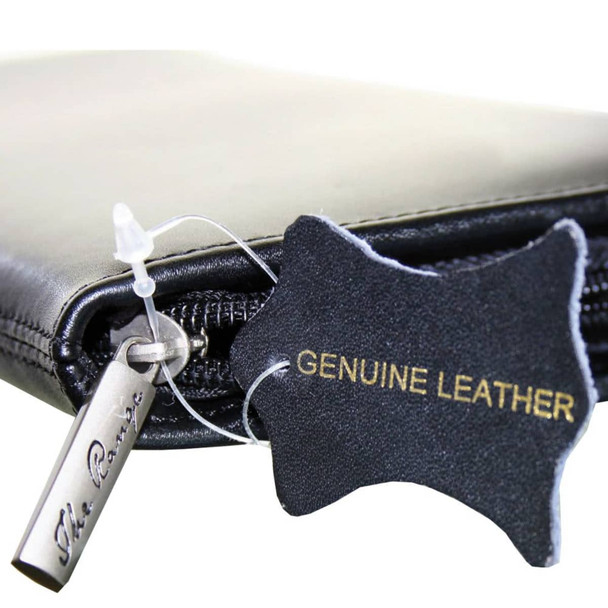 A black leather travel wallet featuring a zipper and a tag indicating genuine leather. It has a small branding logo.