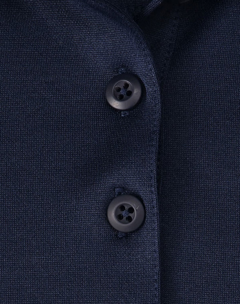 Close-up of a navy blue polo shirt featuring a button placket and a logo. Close-up of a navy blue polo shirt featuring a button placket and a logo.