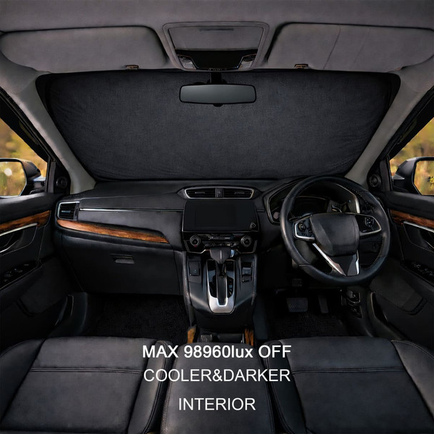 A black reflective car sunshade installed on the windshield of a vehicle, showcasing an interior view.