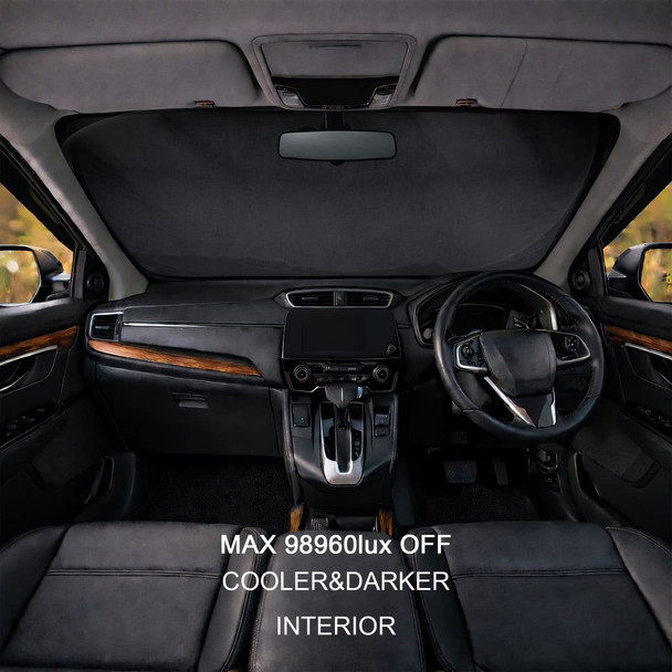 A black reflective car sunshade positioned in a vehicle's dashboard, showcasing a sleek interior design.