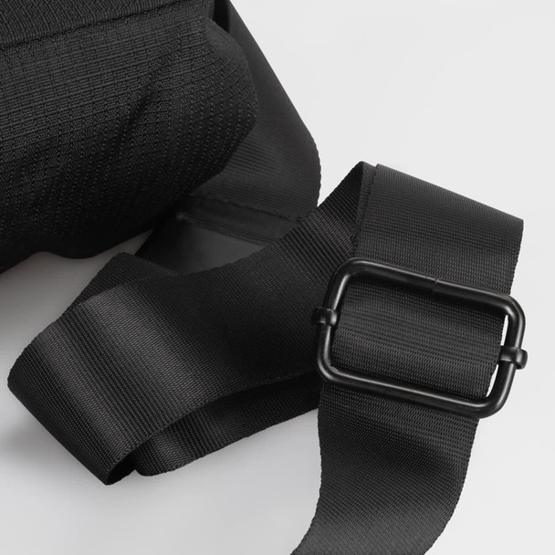 A black sling bag featuring sturdy straps and a metal buckle, showcasing a textured fabric. A black sling bag featuring sturdy straps and a metal buckle, showcasing a textured fabric.