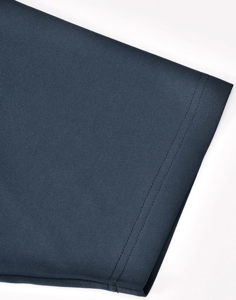 A short sleeve polo shirt in a dark navy blue with a smooth fabric texture and a logo. A short sleeve polo shirt in a dark navy blue with a smooth fabric texture and a logo.