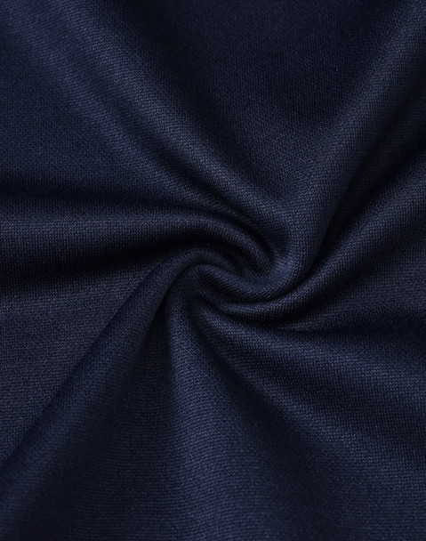 A close-up of dark navy fabric with a smooth texture, showcasing the sustainable poly/cotton blend. A close-up of dark navy fabric with a smooth texture, showcasing the sustainable poly/cotton blend.