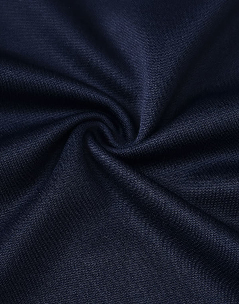 A close-up of dark navy fabric, showing a smooth, textured weave ideal for polo shirts.