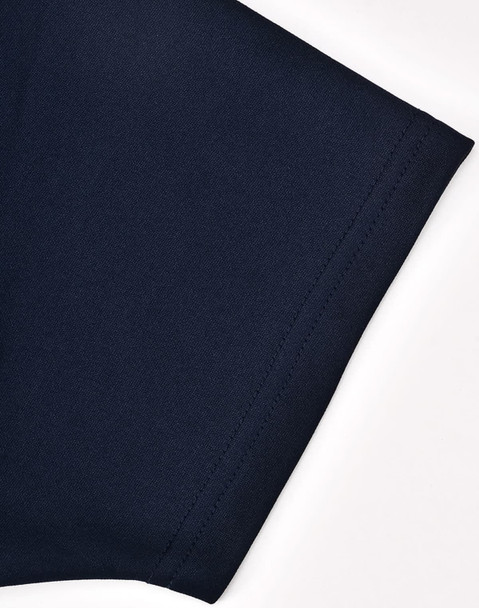 A close-up of a navy polo shirt sleeve with a smooth fabric finish and a subtle logo.
