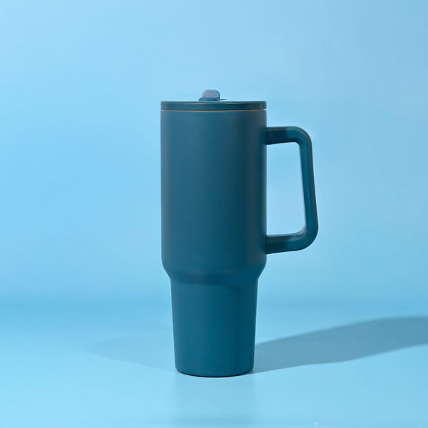 A drink bottle in teal with a handle and a lid, featuring a logo on the body.