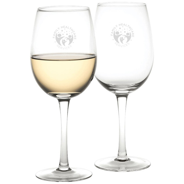 A set of clear glass wine glasses, holding a light-coloured liquid, with a logo printed on one of the glasses.