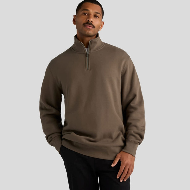 A grey-brown half zip crew jumper with a relaxed fit and a logo displayed.