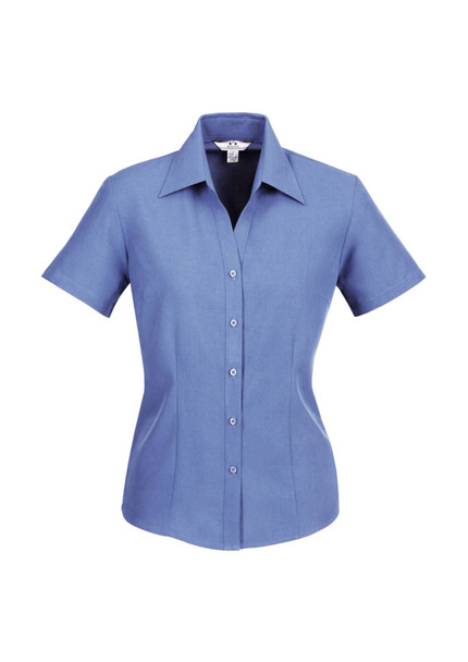 A blue women's short sleeve button-up shirt with a pointed collar and a fitted silhouette, featuring a logo.