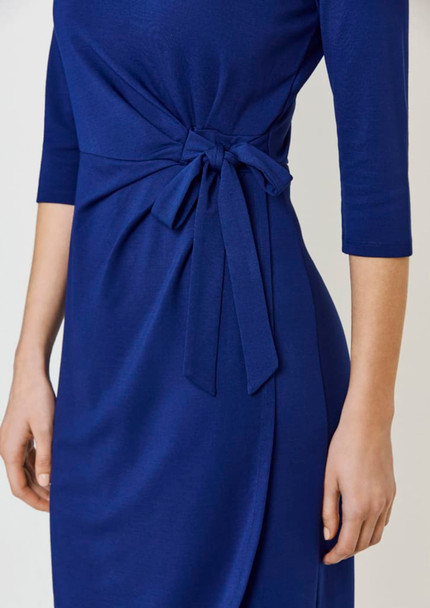 A blue dress featuring a tied detail at the waist and three-quarter sleeves. The dress has a smooth, elegant look.