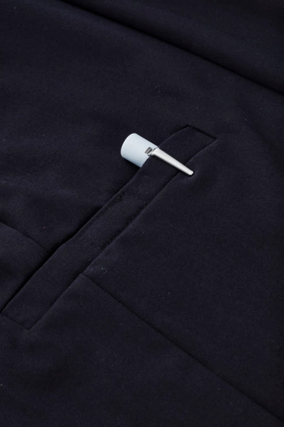 A navy women's comfort waist cargo skirt featuring a side pocket and a hanging tag.