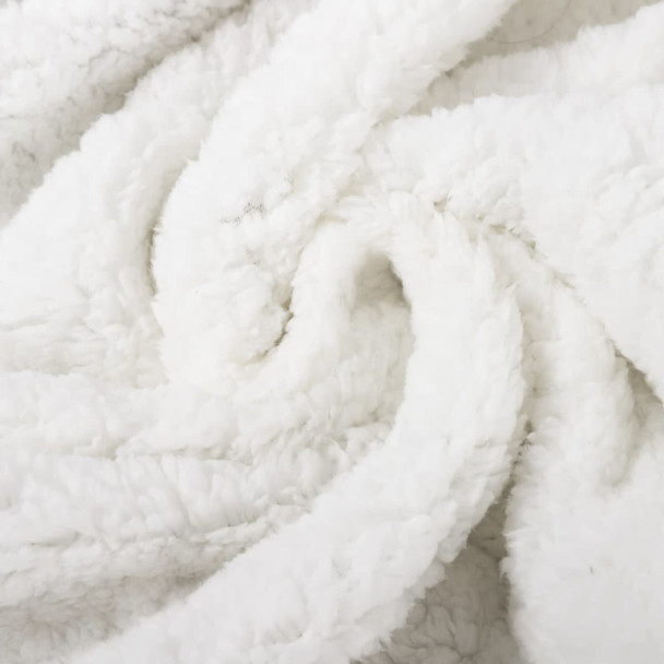 A white, fluffy blanket with a soft, textured surface, showcasing its cozy and luxurious feel.