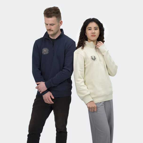 Unisex quarter zip jumpers in navy and cream, featuring a logo on the front, styled on male and female models.