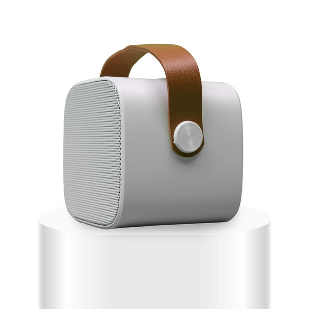 A compact grey boombox mini speaker with a brown handle and a button on the front, featuring a logo.