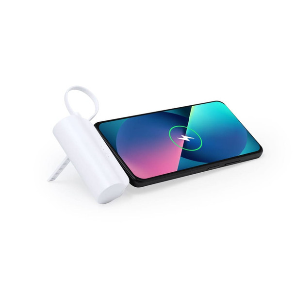A white power bank positioned beside a smartphone displaying a colourful screen. The power bank has a loop for carrying.