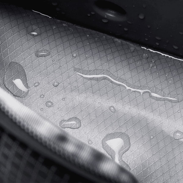 A grey interior of a cooler bag features a textured surface with visible water droplets. It has a logo.