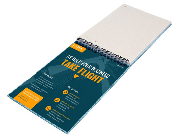 A top-bound A5 notebook with a spiral binding, featuring blank pages and a colourful promotional cover.