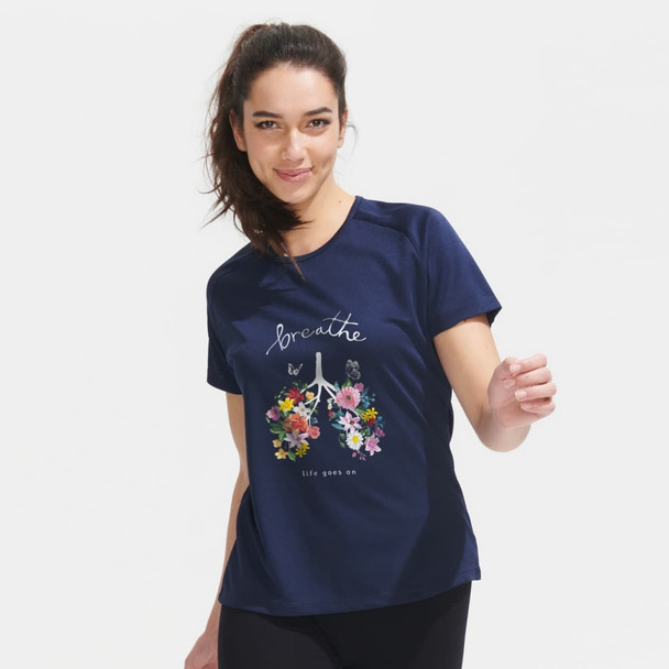 A sporty women's T-shirt in navy blue featuring a floral design and the word "breathe." It has a logo on it.