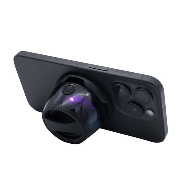 A speaker in black, designed to attach to a smartphone, featuring a rounded shape and a logo on the side.