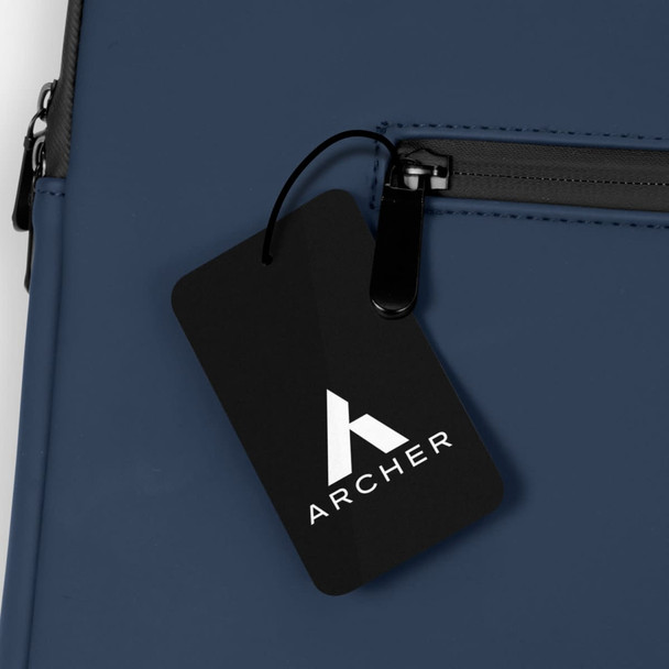 A navy blue soft-touch laptop sleeve featuring a zippered pocket and a branded tag.