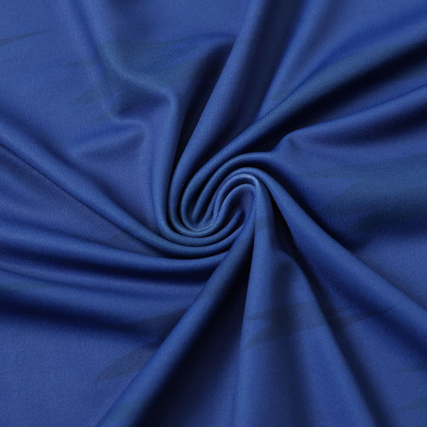 A close-up of royal blue fabric, featuring a smooth and stretchy texture ideal for clothing.