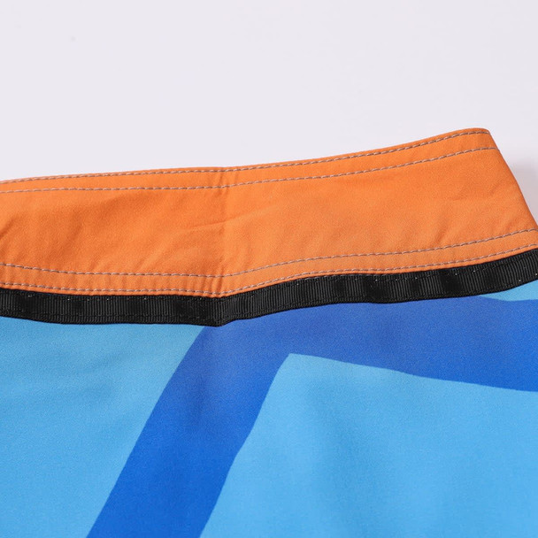 Men's knee-length swim shorts in blue with an orange waistband and a logo, made from polyester and spandex. Men's knee-length swim shorts in blue with an orange waistband and a logo, made from polyester and spandex.