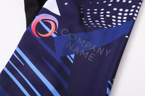 Men's sublimated cycling bib tights in vibrant blue and black with a logo prominently displayed.