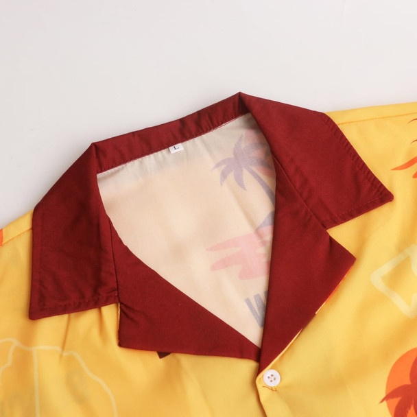 A yellow Cuban collar shirt with a maroon collar, featuring a tropical pattern. It has buttons at the front and a logo.