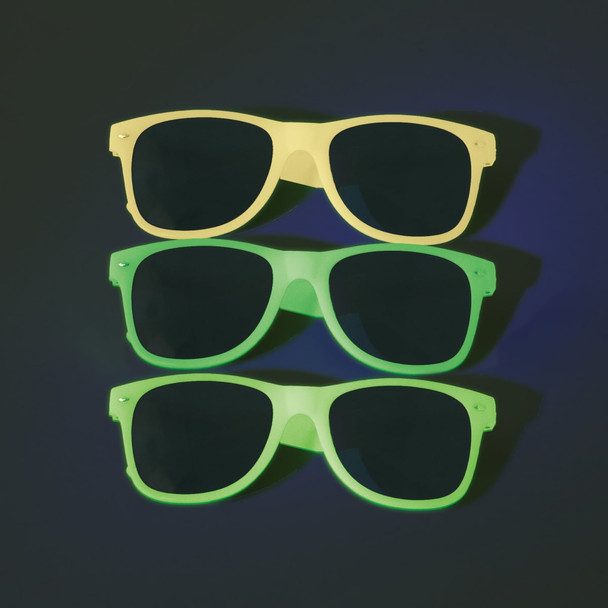 Three pairs of glow-in-the-dark sunglasses in yellow and two shades of green, with dark lenses. Each pair has a logo.