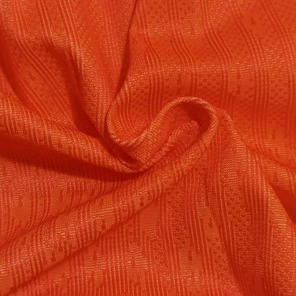Bright orange fabric with a textured pattern, suitable for breathable sports shorts. Includes a logo or branding. Bright orange fabric with a textured pattern, suitable for breathable sports shorts. Includes a logo or branding.