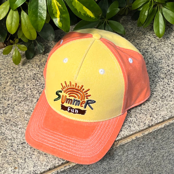 A colour changing baseball cap with a yellow and orange design, featuring an embroidered logo on the front.
