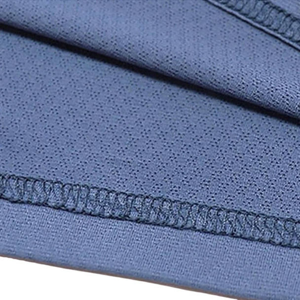 A close-up of a soft, blue polyester spandex fabric with visible stitching details. A close-up of a soft, blue polyester spandex fabric with visible stitching details.