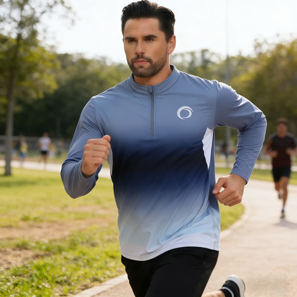 A man jogging in a long-sleeved shirt featuring a blue and white gradient design and a collar with a logo.
