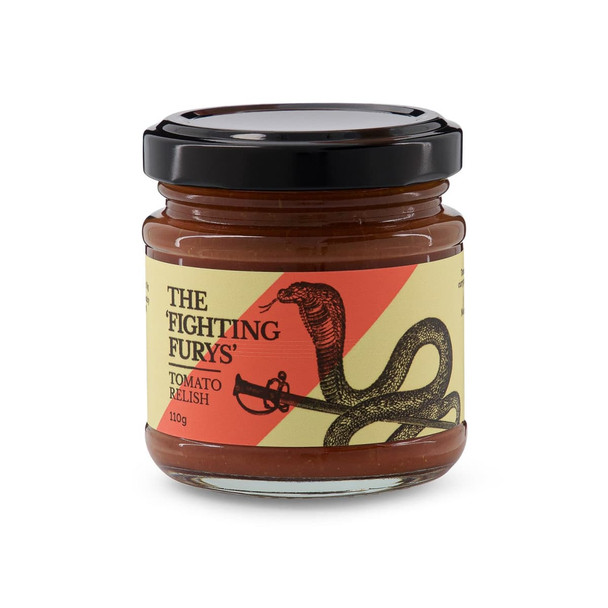A jar of tomato relish featuring a black lid, with a design of a snake and a sword, in red and yellow tones.