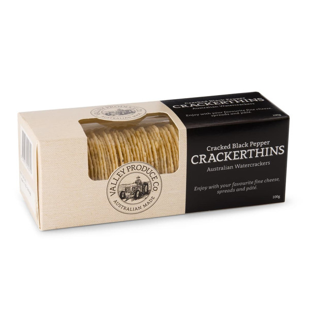 A box of Cracked Black Pepper Crackerthins featuring a stack of thin water crackers. The box has a logo and a beige colour scheme.