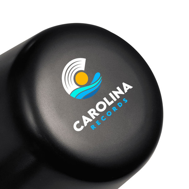 A black lamp with a rounded top featuring a logo design. The lamp is compact and rechargeable.