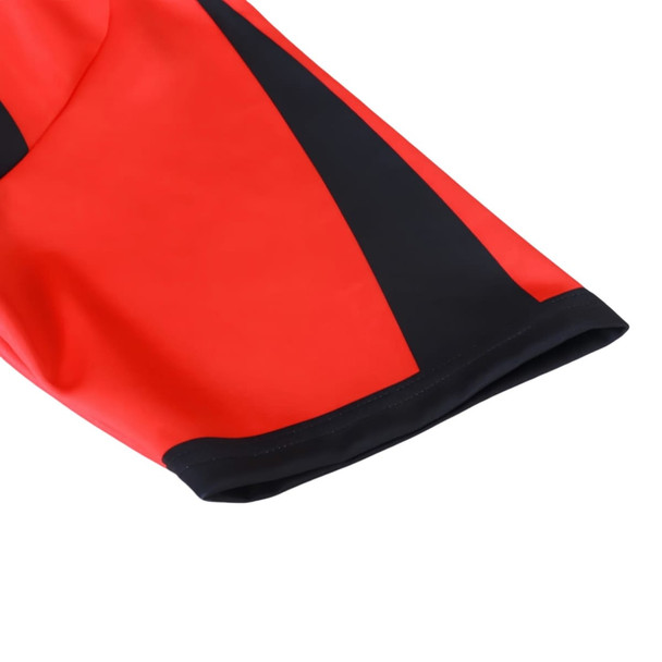 A red and black crew neck raglan sport tee shirt with a micro mesh design and a logo. A red and black crew neck raglan sport tee shirt with a micro mesh design and a logo.