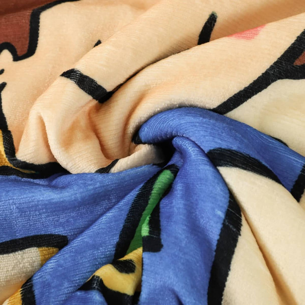 A colourful, patterned wearable blanket made from 100% polyester, featuring a soft and plush texture.