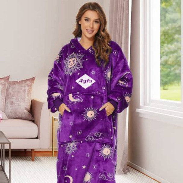 A purple unisex wearable blanket with a hood and absorbent lining, featuring celestial patterns and a logo. A purple unisex wearable blanket with a hood and absorbent lining, featuring celestial patterns and a logo.
