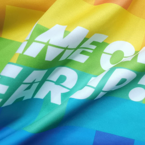 A vibrant polyester spandex fabric in shades of yellow, blue, and green, featuring a multicoloured pixelated design. A vibrant polyester spandex fabric in shades of yellow, blue, and green, featuring a multicoloured pixelated design.