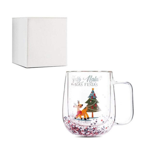 A transparent glass mug with a festive design, featuring a Christmas tree and colourful glitter. Includes a white box.
