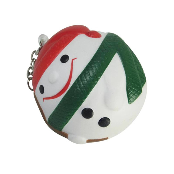 A keyring featuring a smiling snowman design in white, green, and red, with black accents and a metal chain.