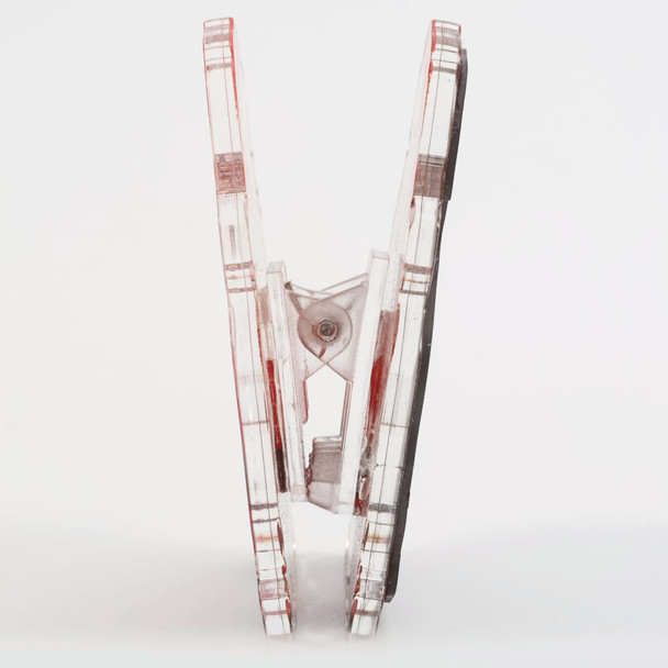 A clear acrylic magnetic clip with a red design, showcasing its custom shape and sturdy build.